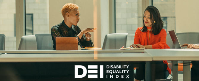 DEI logo with two women signing