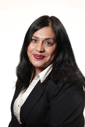 Headshot of Davina, a South Asian woman smiling with long dark hair wearing red lipstick.