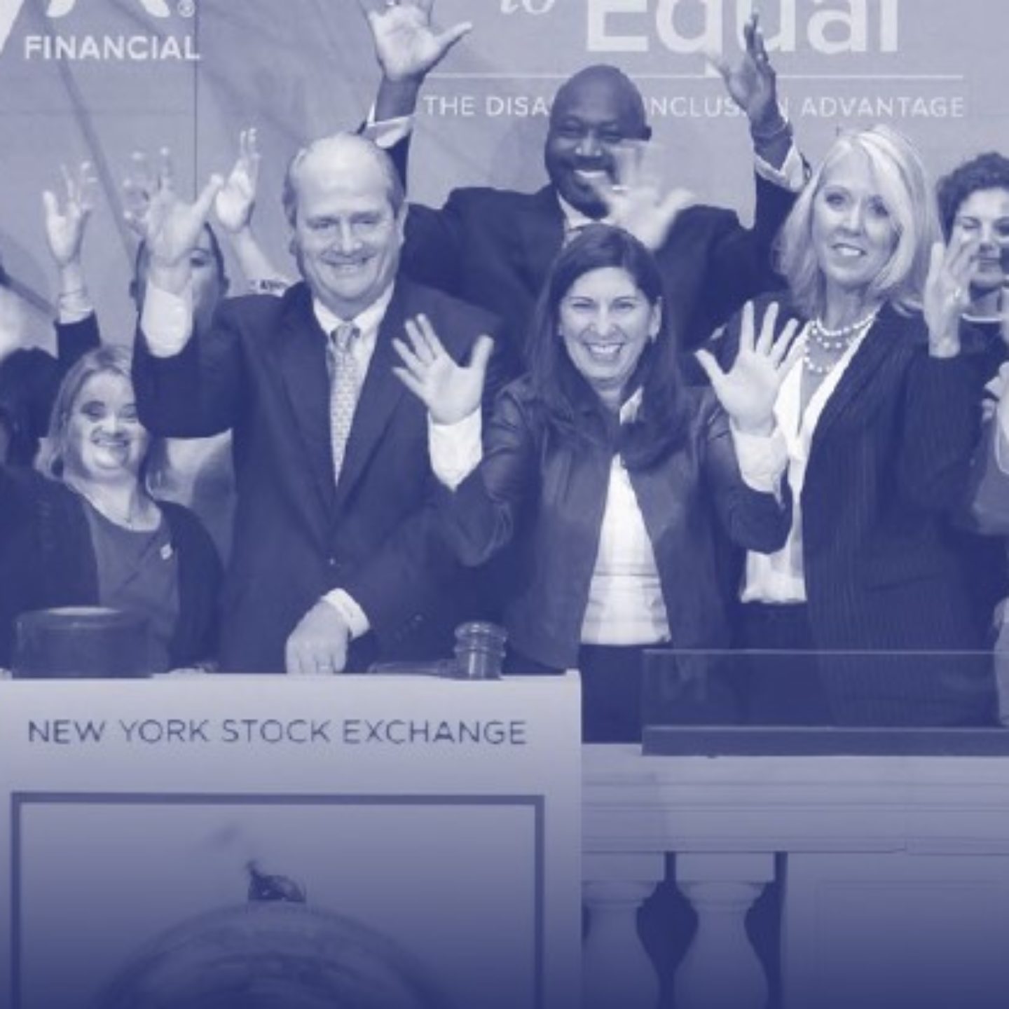 Business professionals standing at NYSE ringing bell