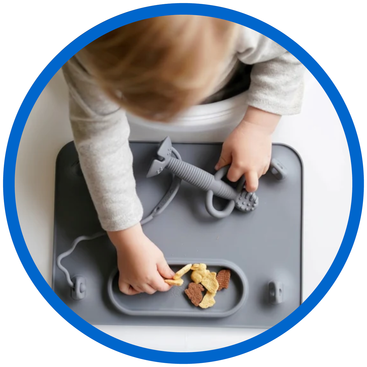 Grey Busy Baby Mat with toddler playing with utensils.