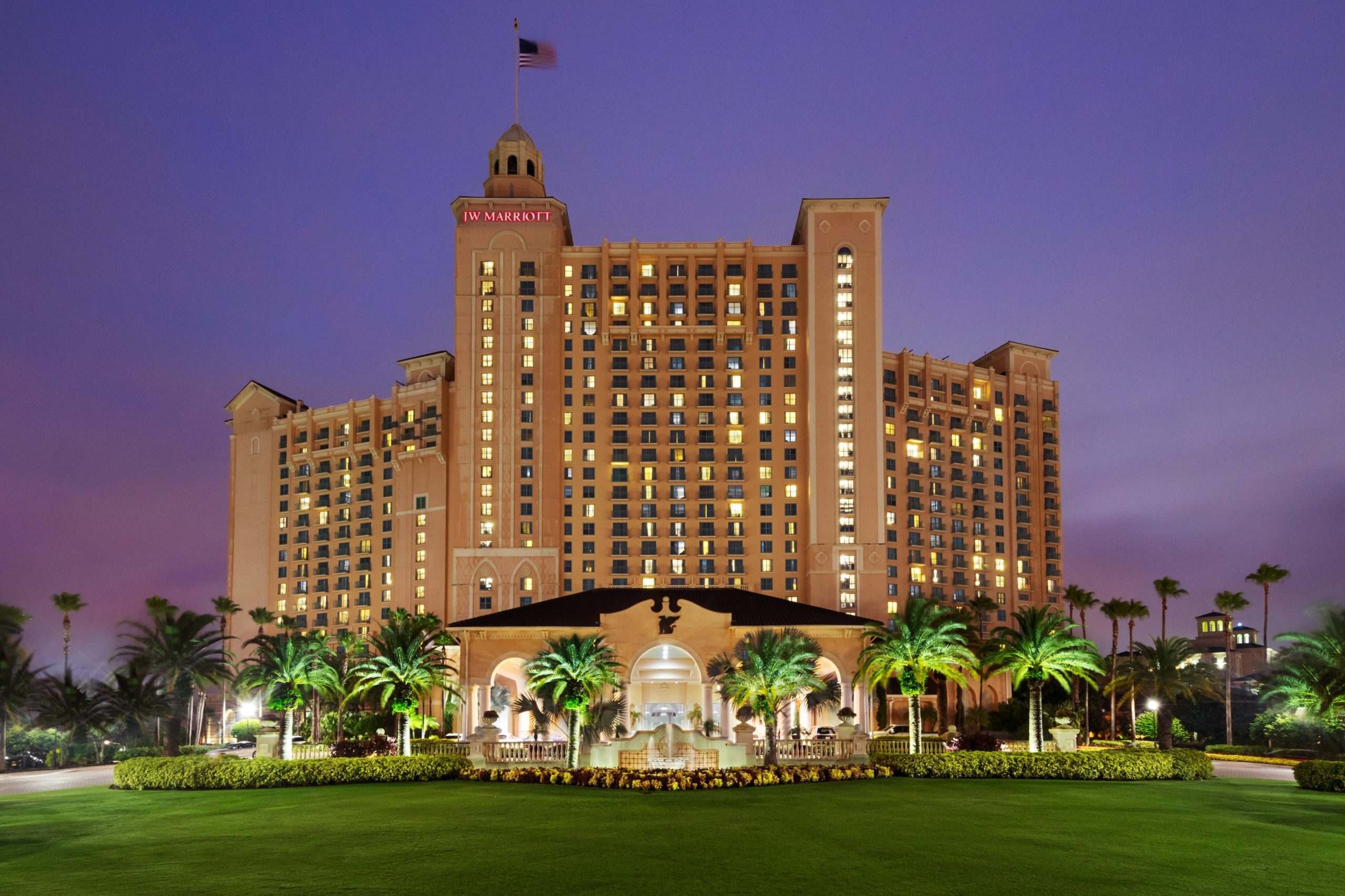JW Marriott Grande Lakes, Orlando Exterior Hotel with palm trees around.