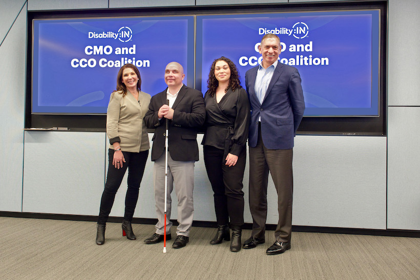 Accenture's Jill Kramer; Disability:IN's Allyce Torres and Russell Shaffer; TD Bank's John Pluhowski pose against Disability:IN CMO & CCO Coalition signage.