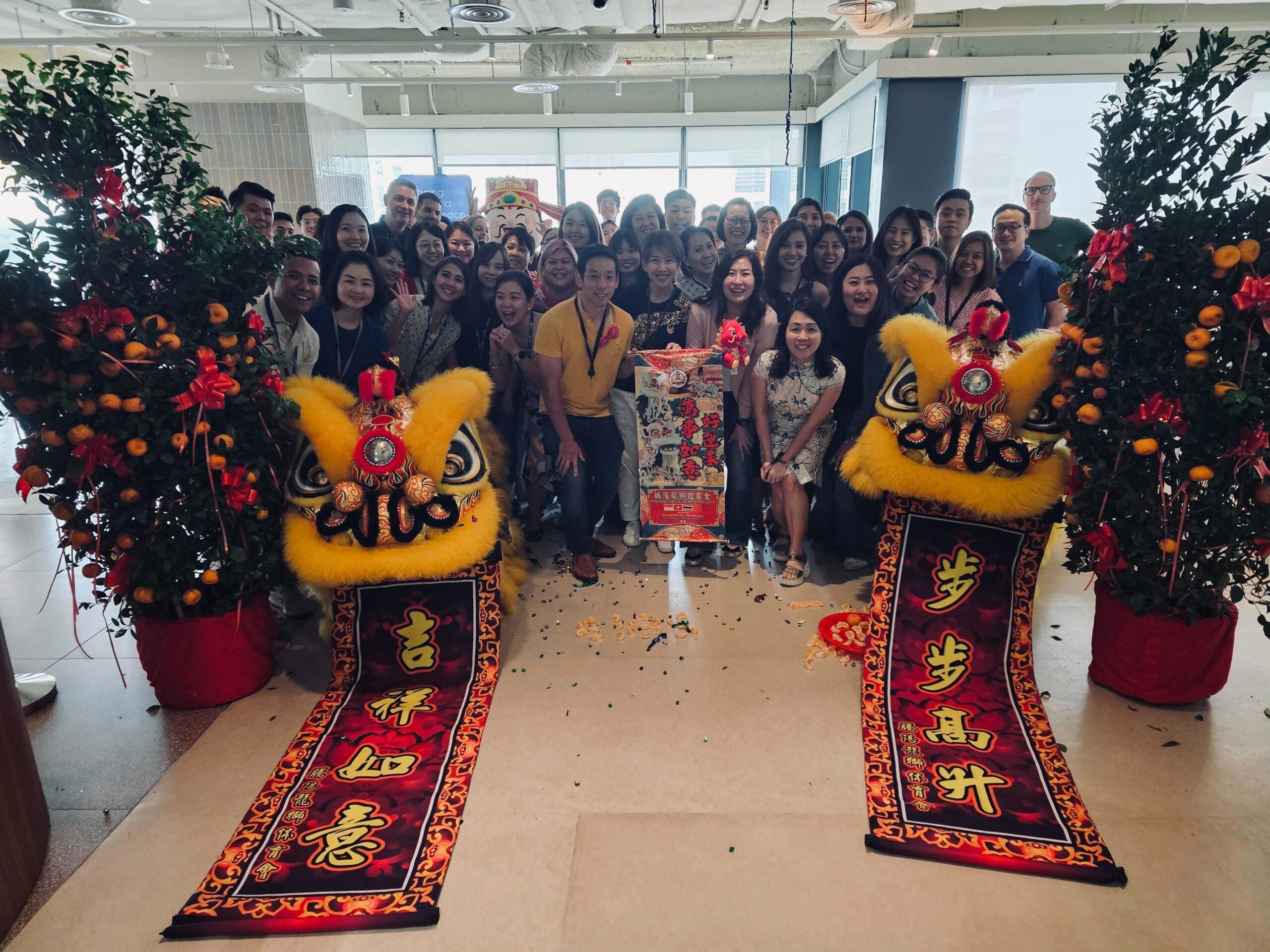 Employees from the Expedia Group Singapore office at the Open Pathways Apprenticeship Program launch ceremony that featured a traditional Chinese Dragon dance.