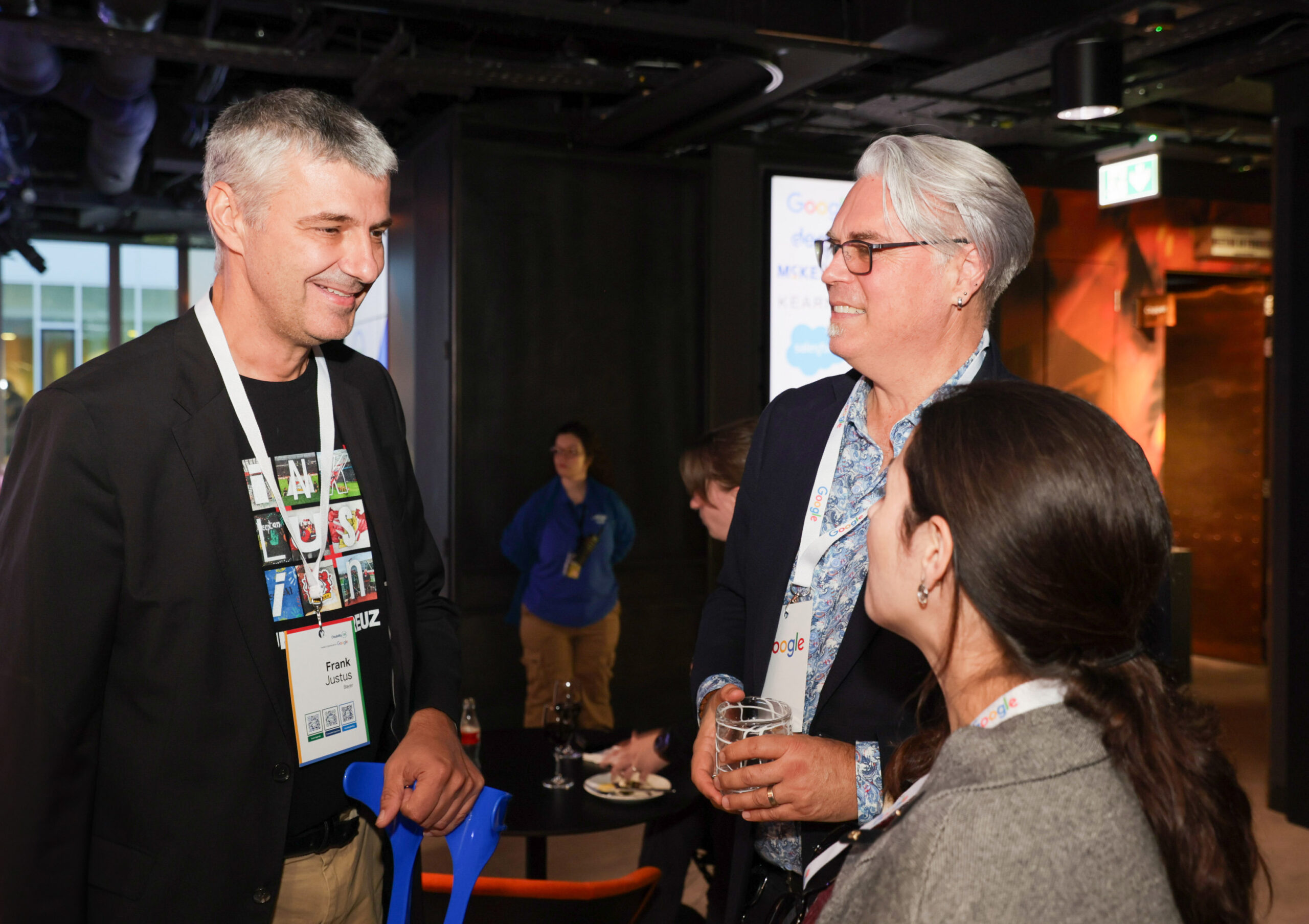 Frank Justus and Christopher Patnoe engage in conversation at the event.