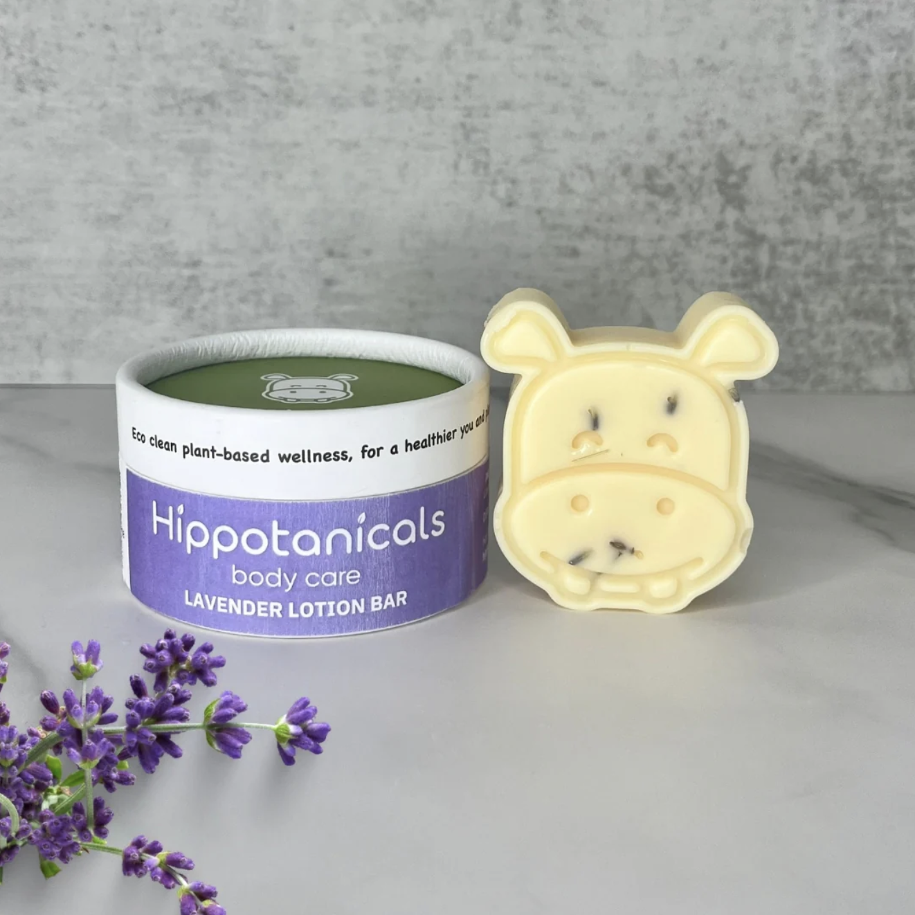 Hippotanicals Hippo-Shaped Solid Lotion bar with packaging carrier. 